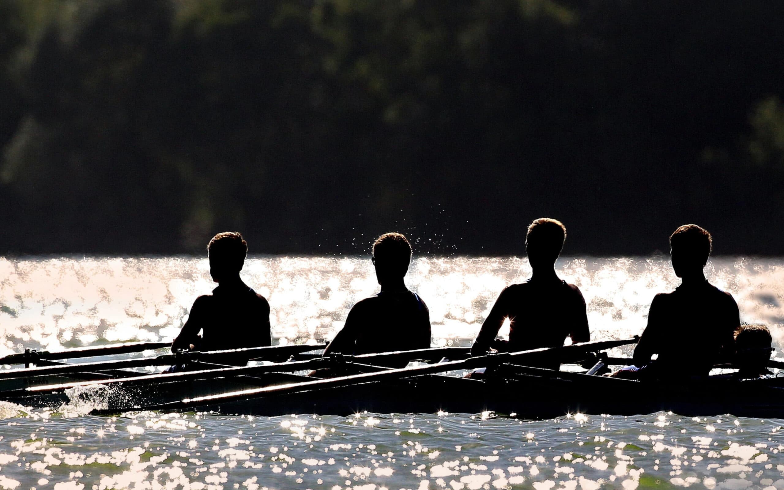 Men rowing in row boat race